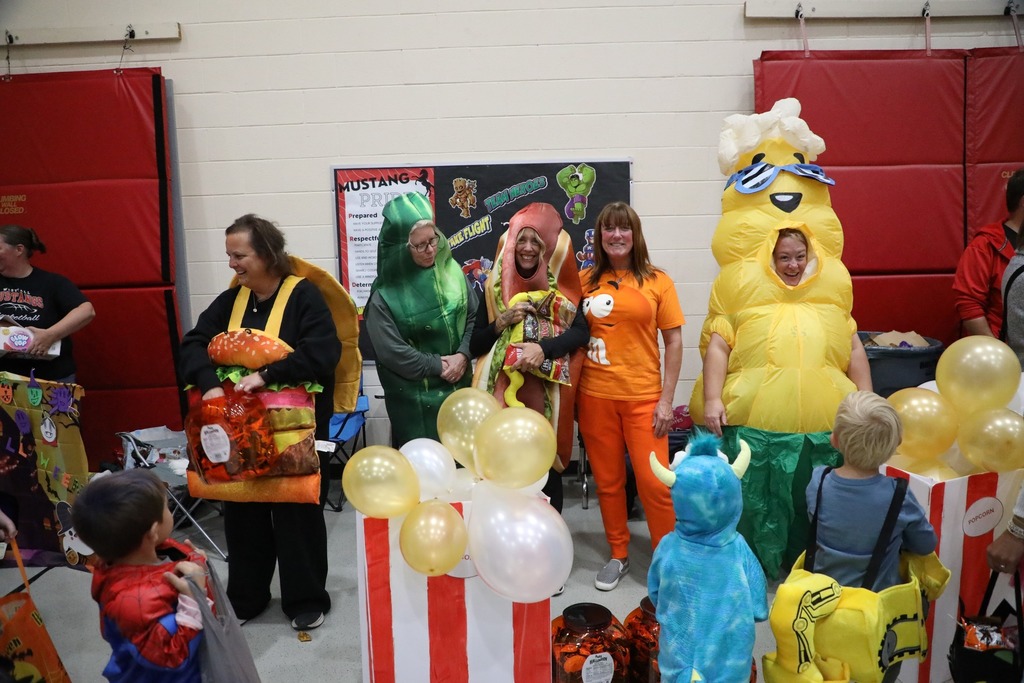 Volunteers dressed up in costume for trunk or treat