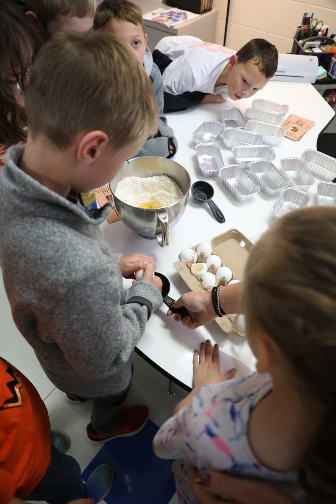 Student cracking an egg