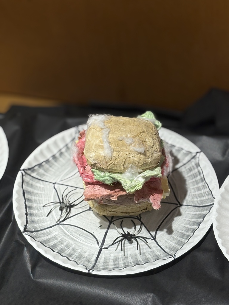 Cheeseburger art sculpture created out of toilet paper