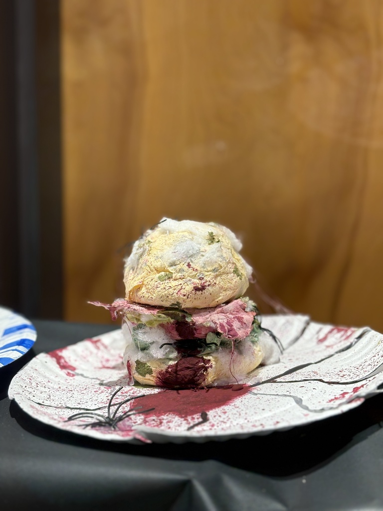 Cheeseburger art sculpture created out of toilet paper