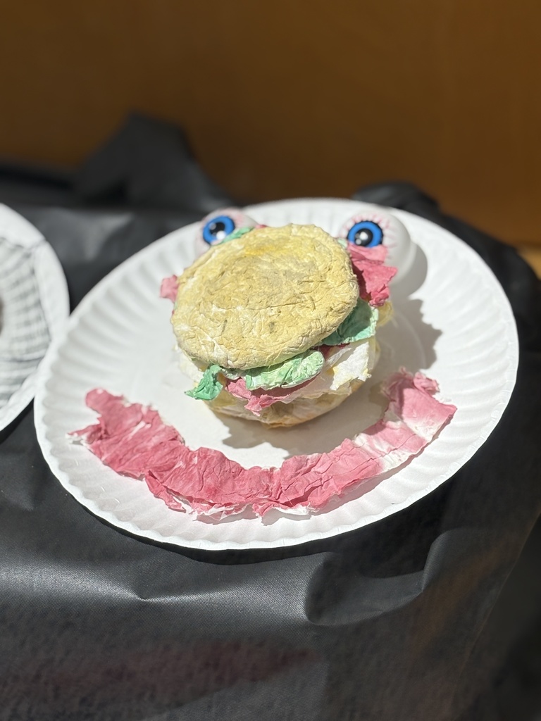 Cheeseburger art sculpture created out of toilet paper