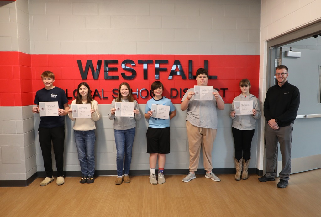 WMS Students of the Month holding certificates