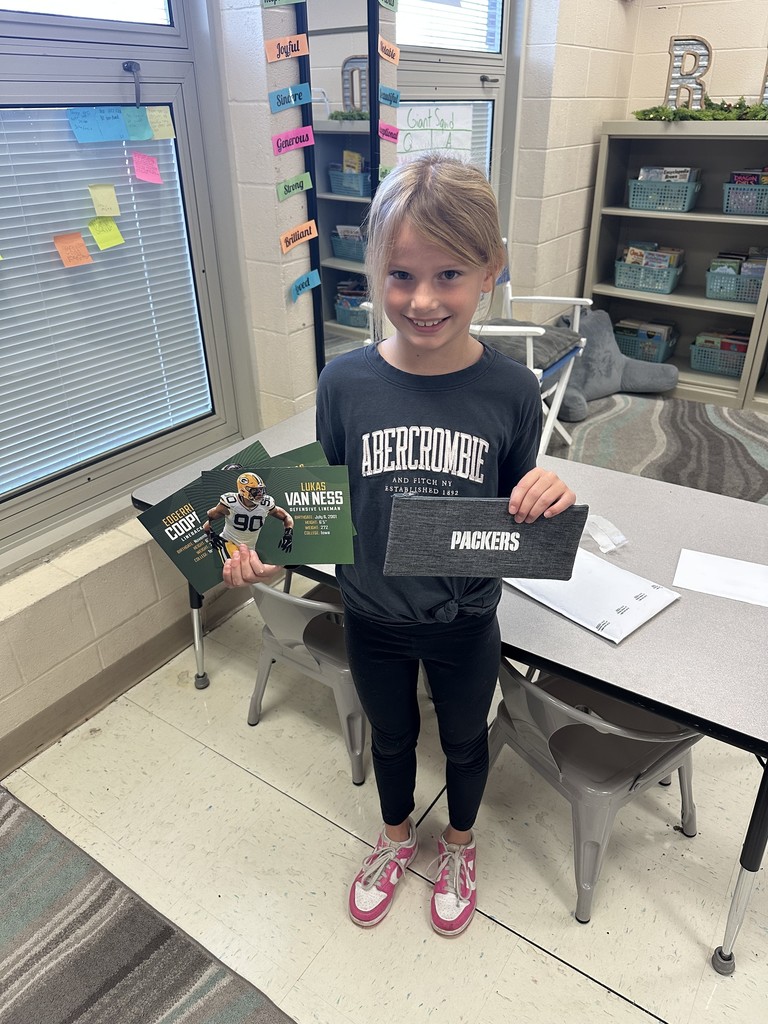 Madyson with her Green Bay Packers gifts
