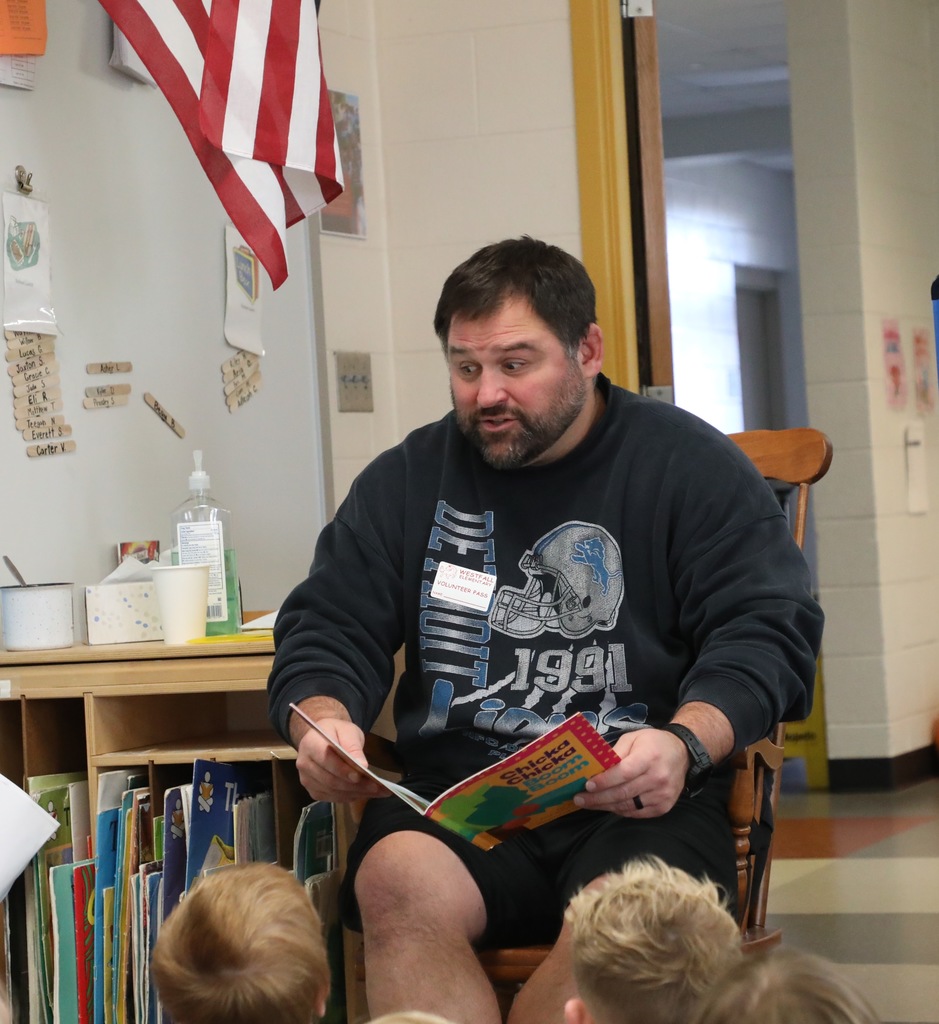 Mr Breyer reading to the students