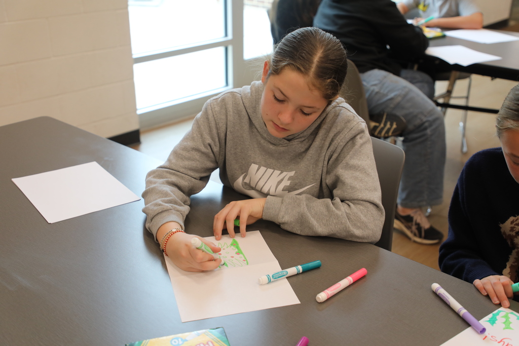 Student working on a holiday card
