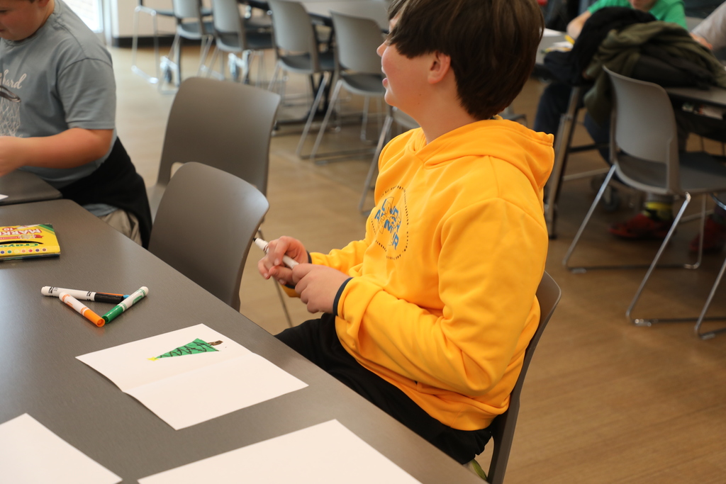 Student working on a holiday card