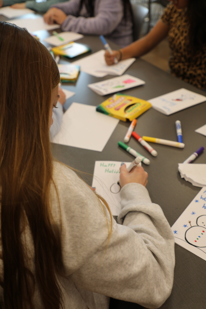 Student working on a holiday card