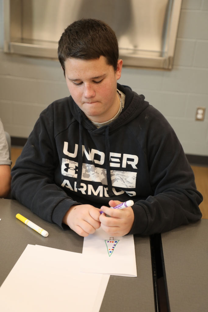 Student working on a holiday card
