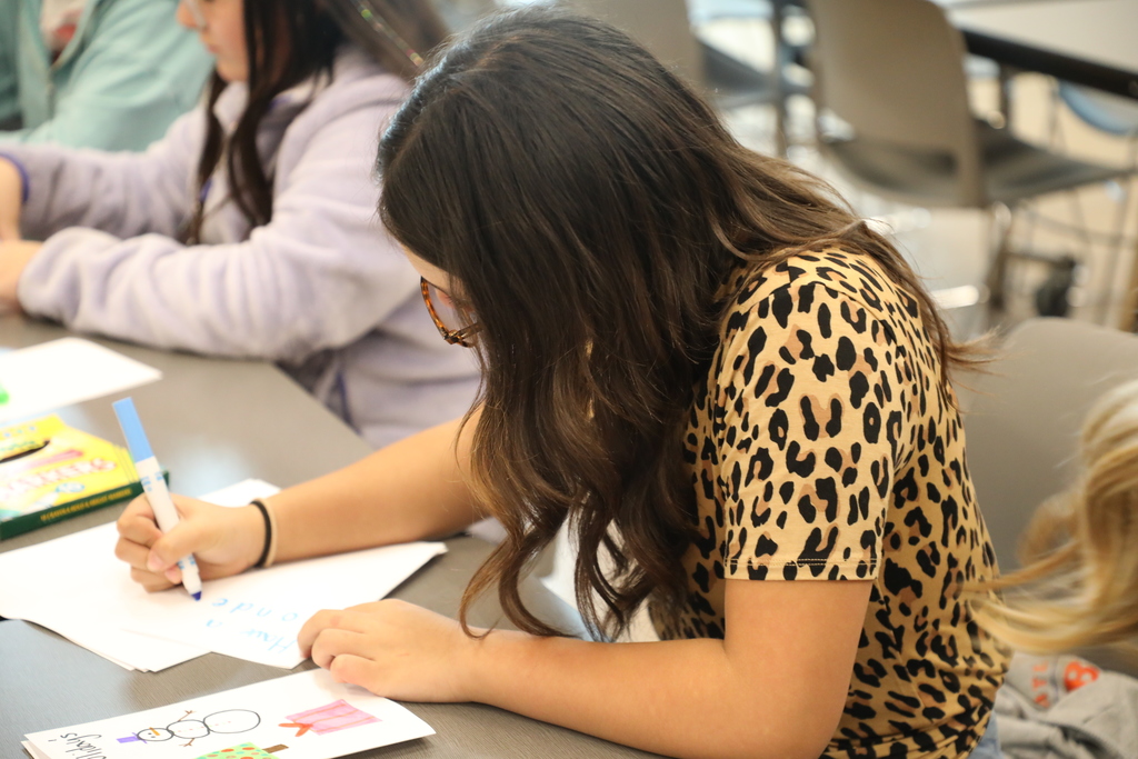 Student working on a holiday card