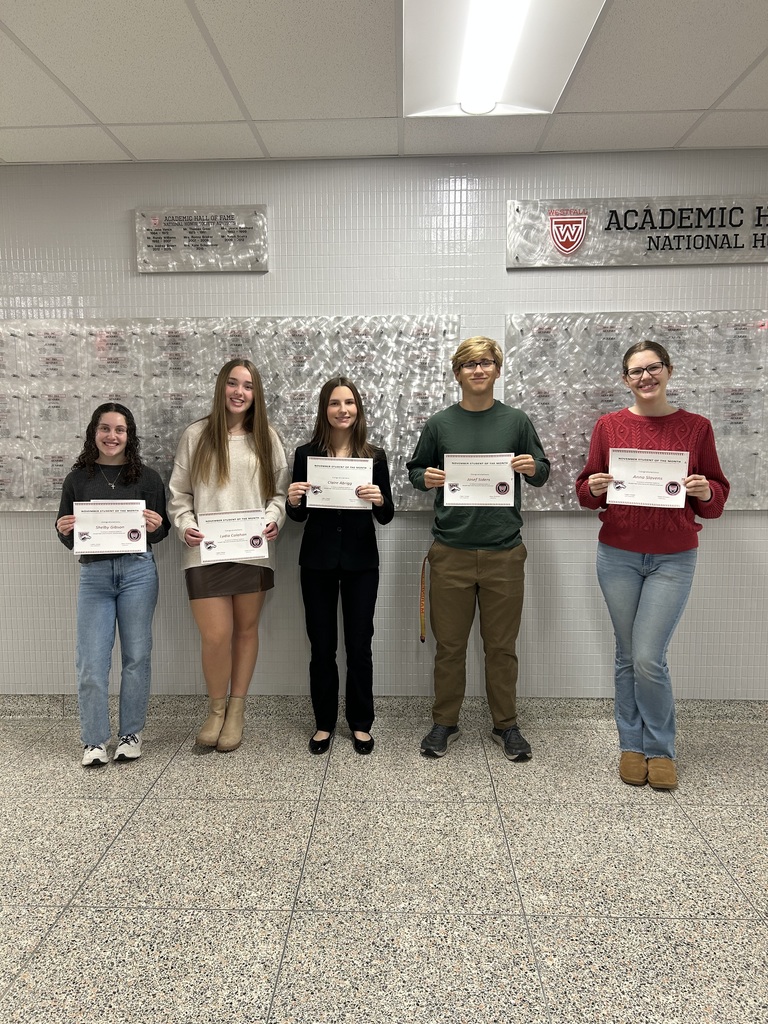 Students of the Month posing with certificates