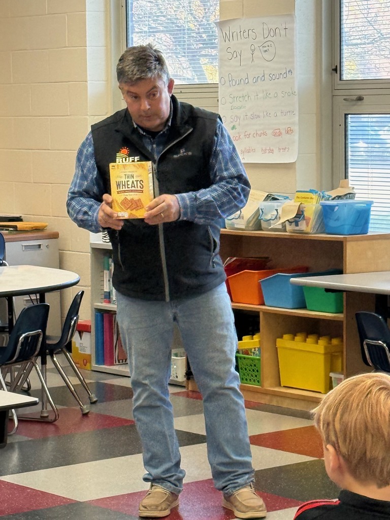 Mr. Ruff holding a box of Thin Wheats