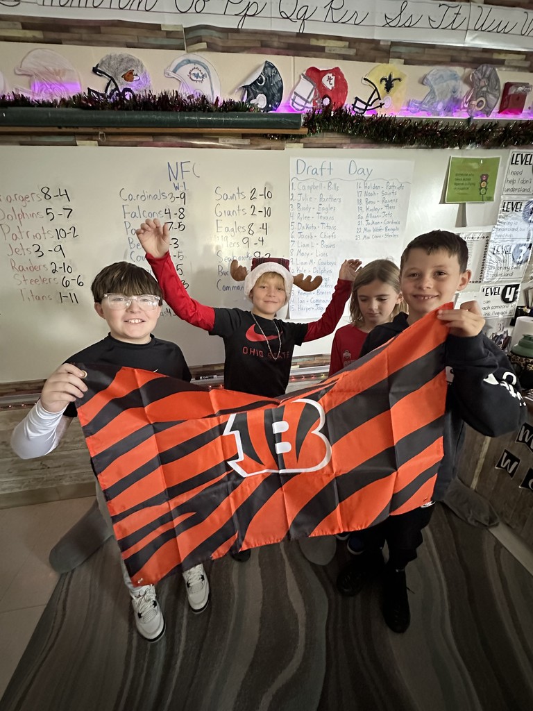 Students posing with Cincinnati Bengals flag