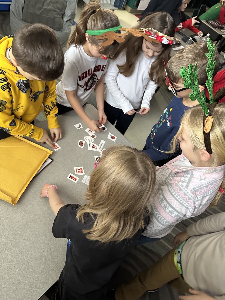 Students looking at stickers