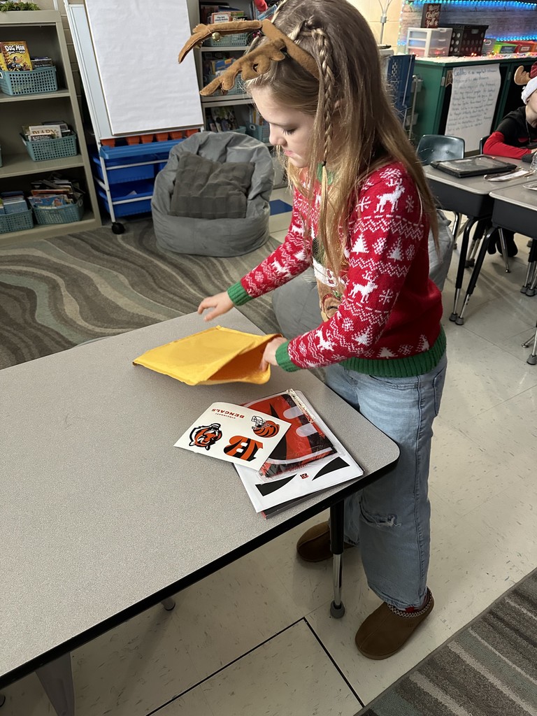 Kinsley opening the envelope