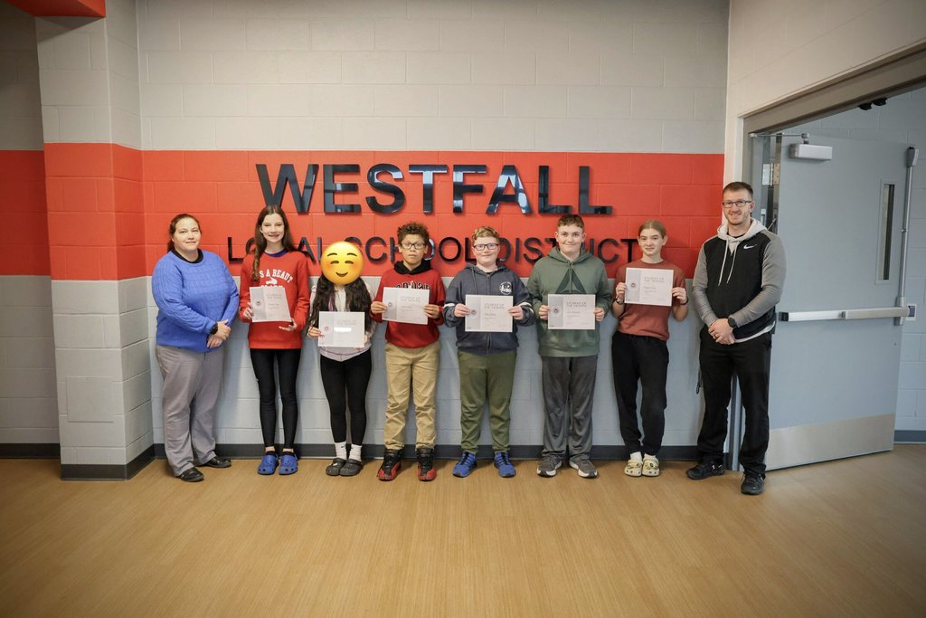 Students of the Month posing with certificates