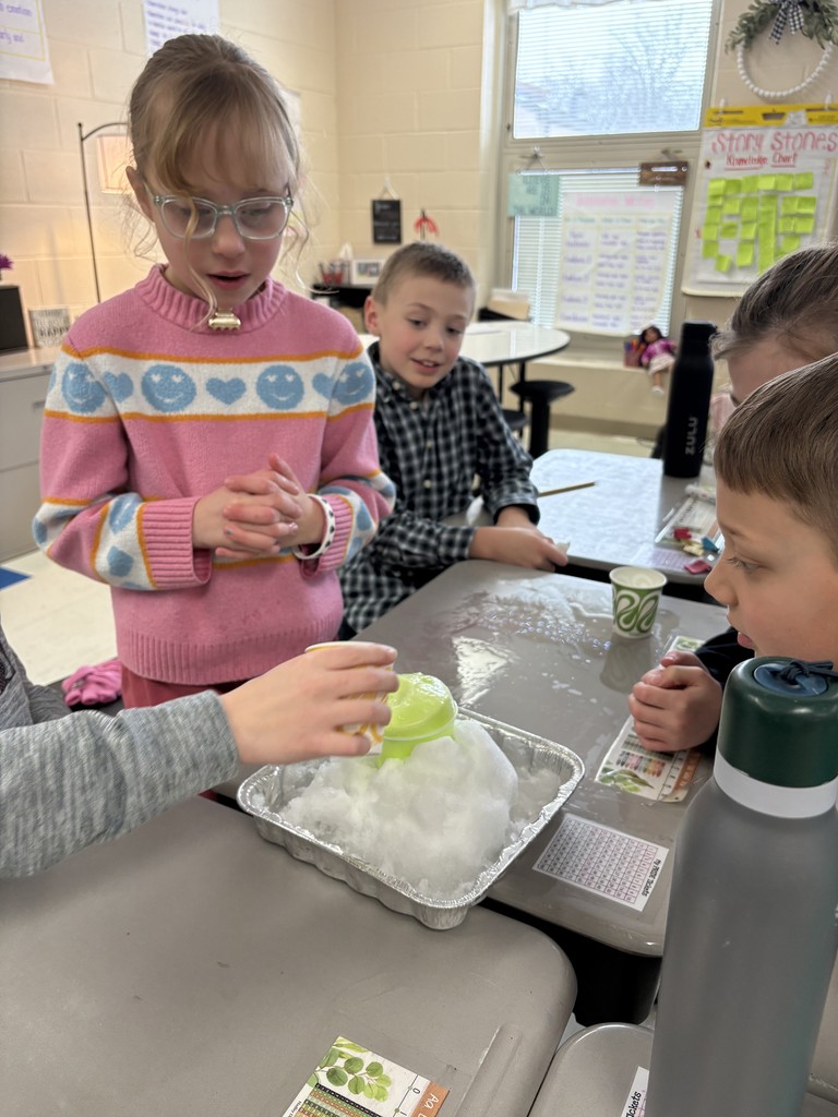 Students creating a snow volcano in the classroom