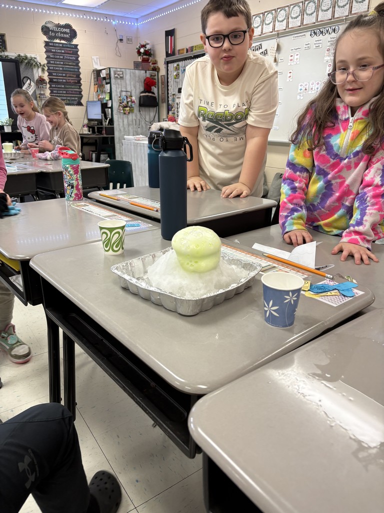 Students creating a snow volcano in the classroom
