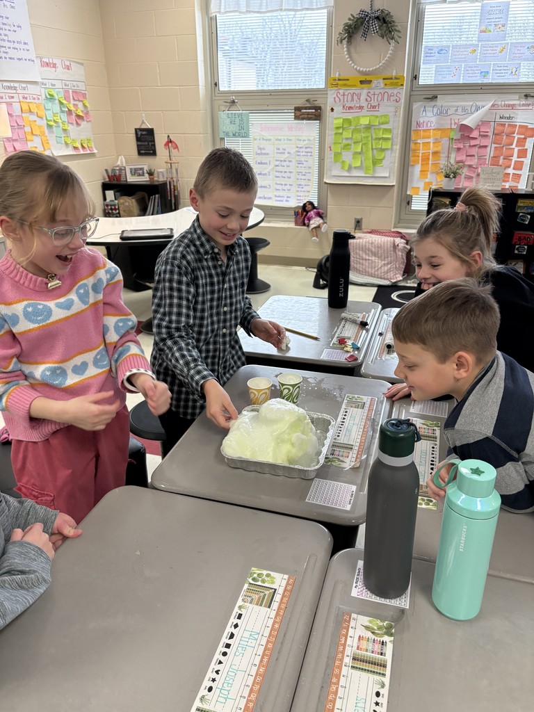 Students creating a snow volcano in the classroom