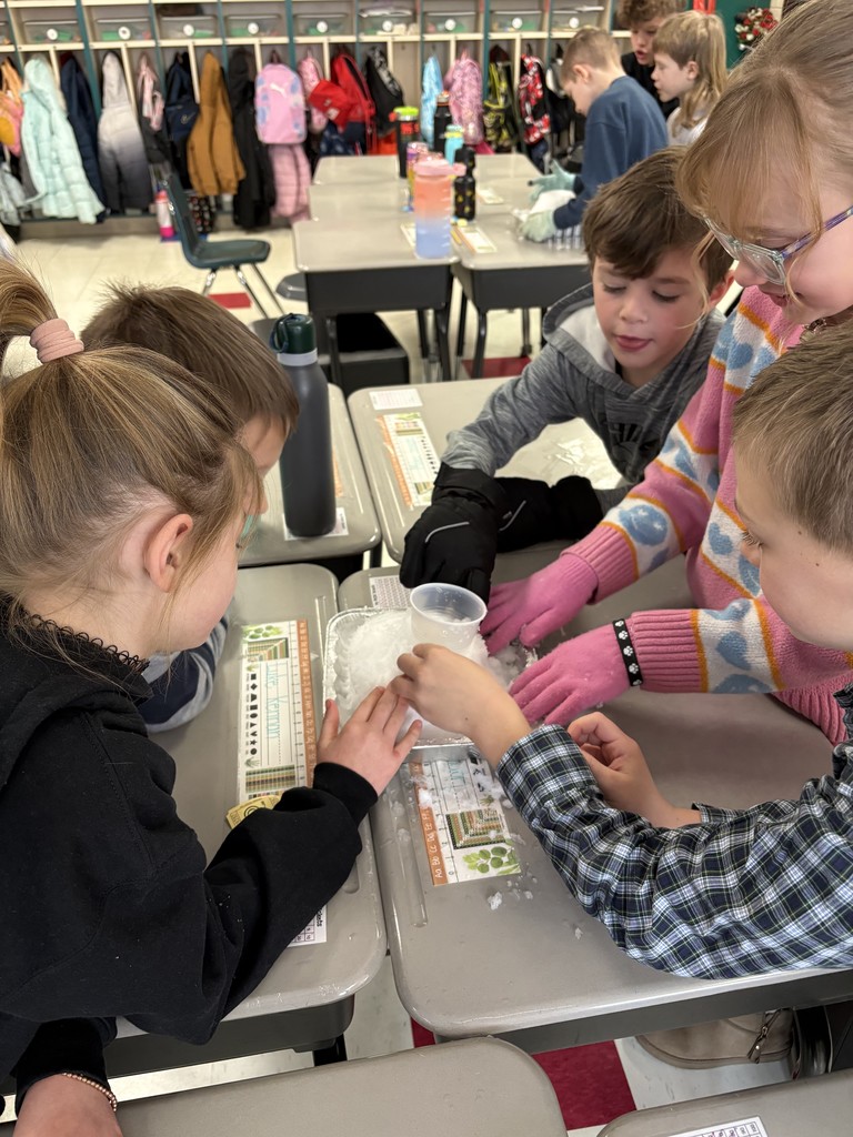 Students creating a snow volcano in the classroom