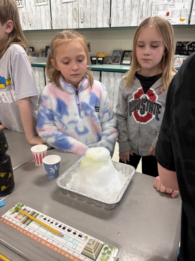 Students creating a snow volcano in the classroom
