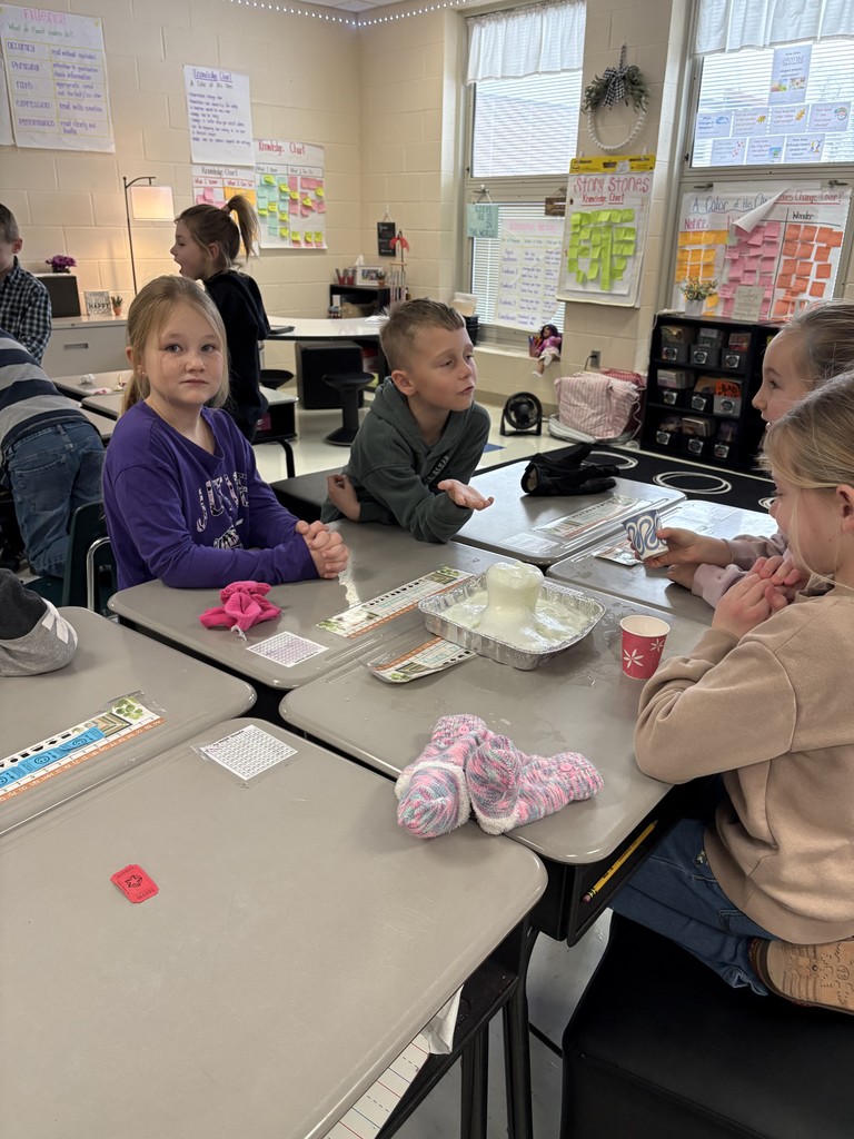 Students creating a snow volcano in the classroom