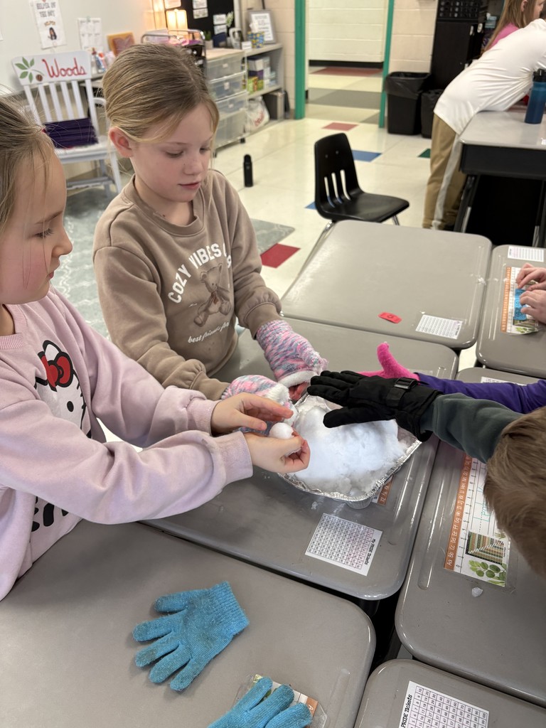 Students creating a snow volcano in the classroom