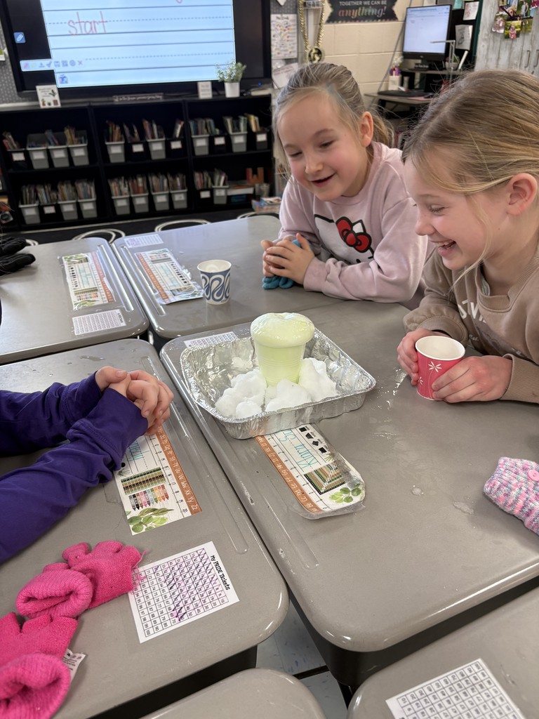 Students creating a snow volcano in the classroom