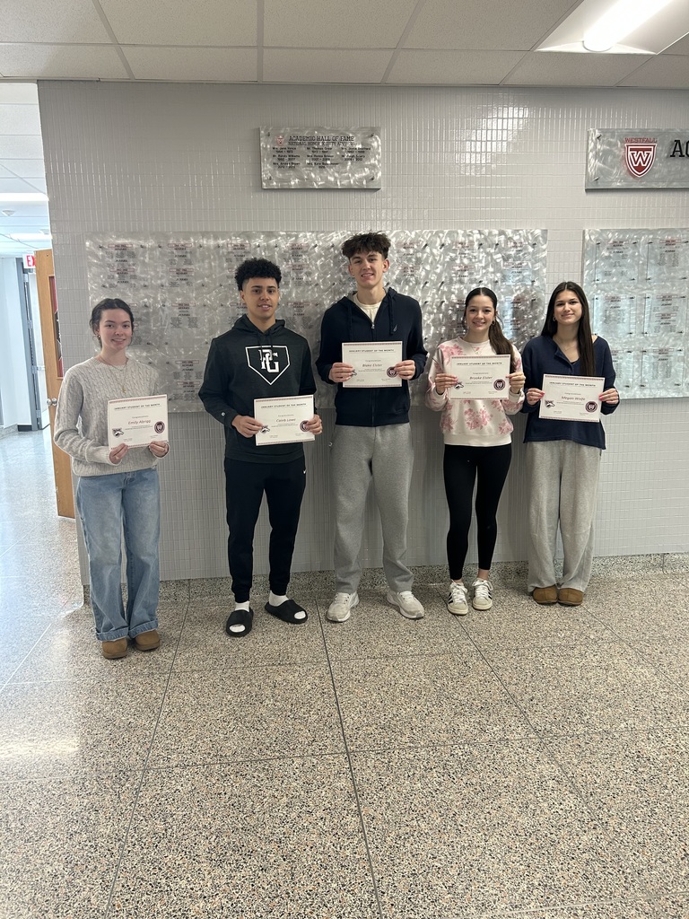 Students of the Month posing with certificates