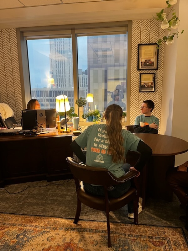 Whs Student and CHS student speak with government representative in an office