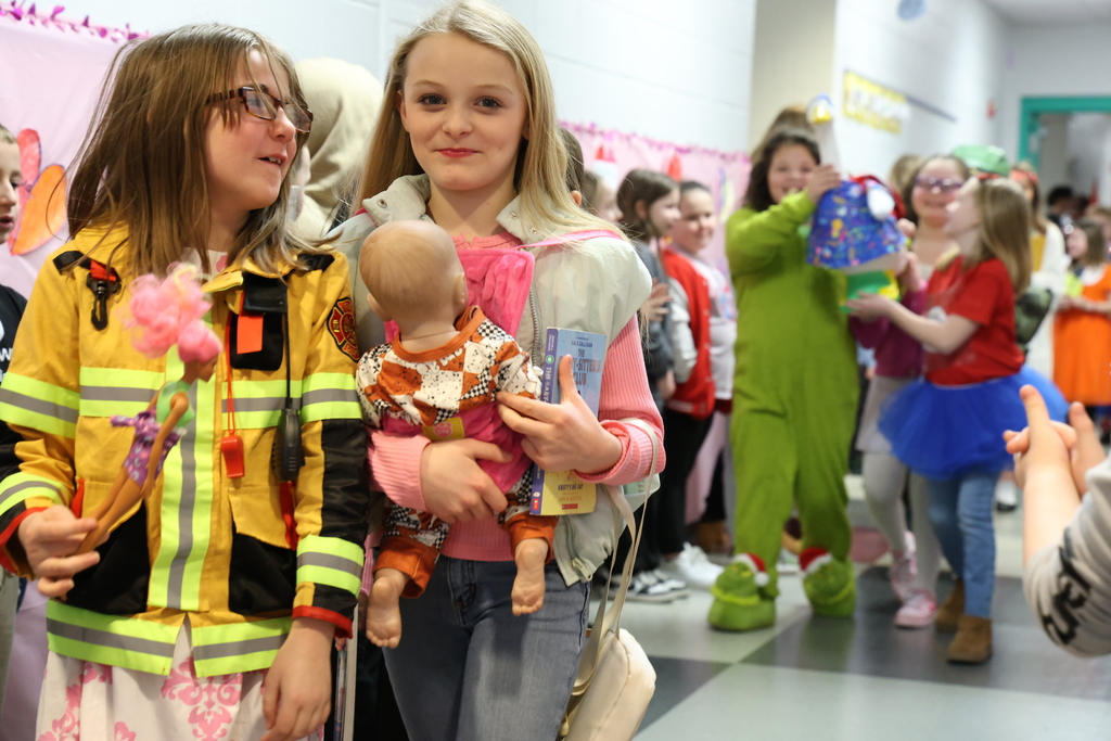 two female students dressed like a fireman and a babysitter