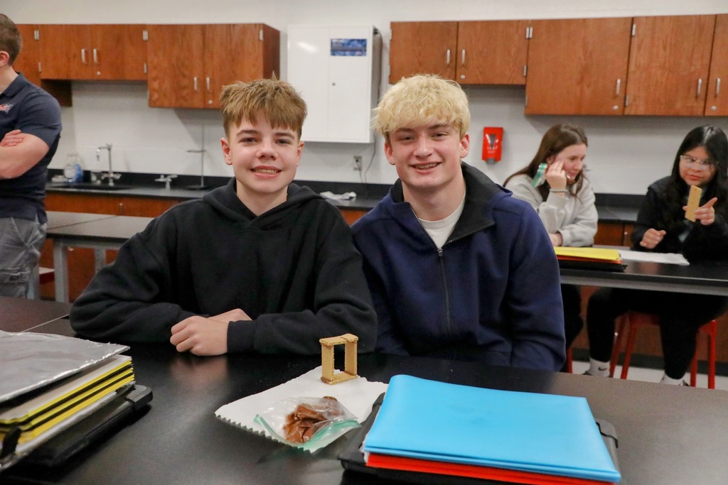 Students posing with their "welded" graham crackers held together with chocolate frosting