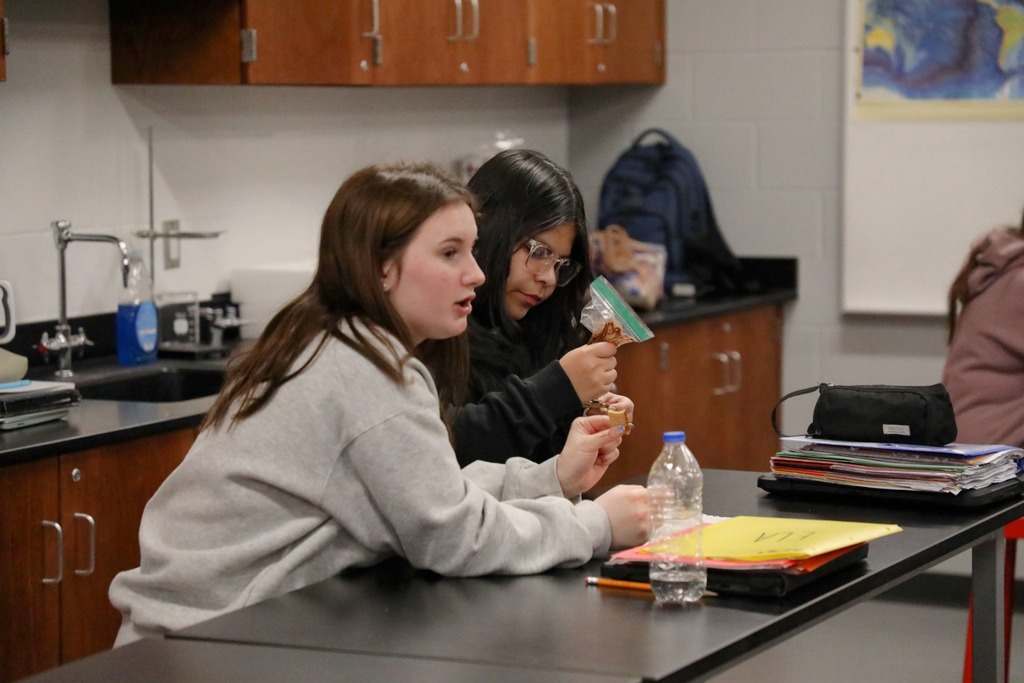Students "welding" graham crackers held together with chocolate frosting