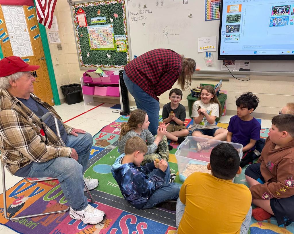 Students holding baby chicks