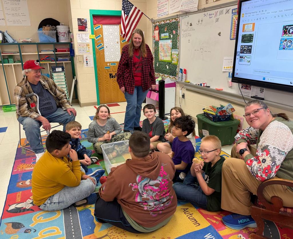 Students holding baby chicks