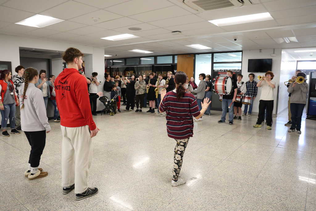 Students watching band play