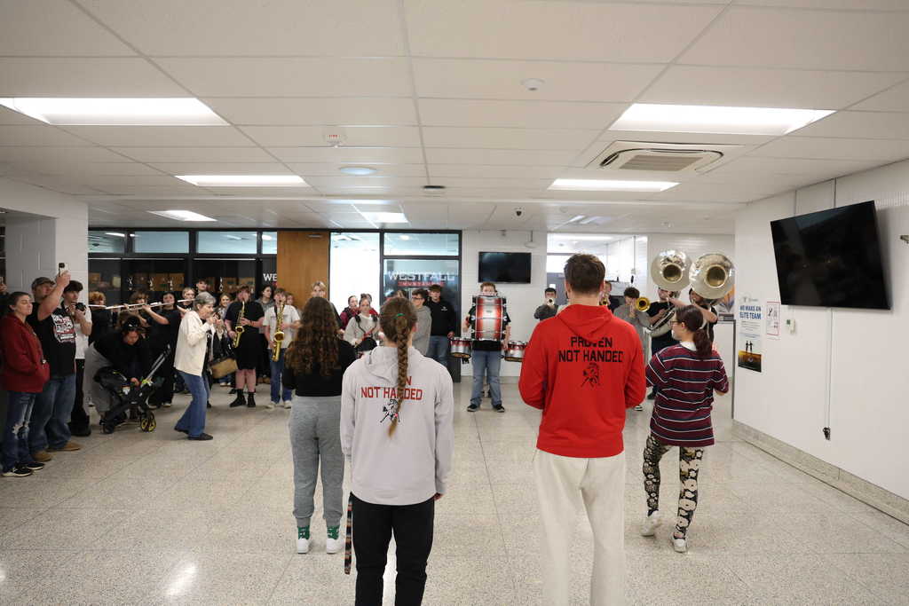 Students watching band play