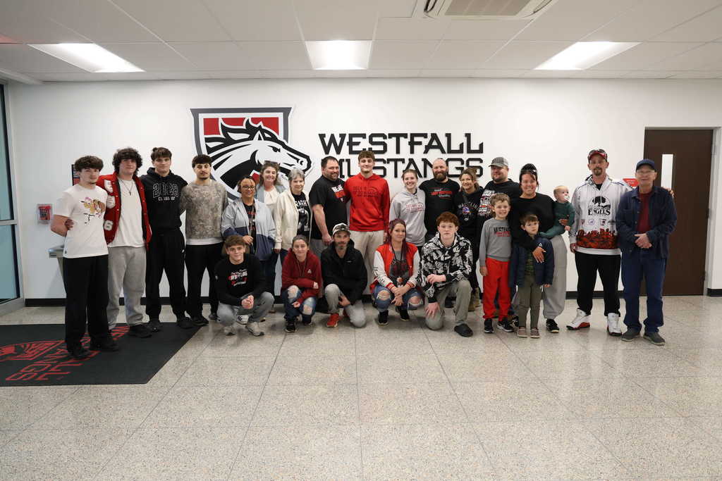 Group photo of students, parents, and coaches