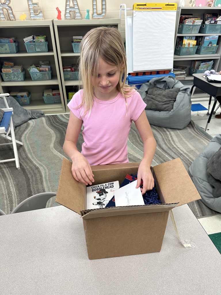 Madyson opening a brown box