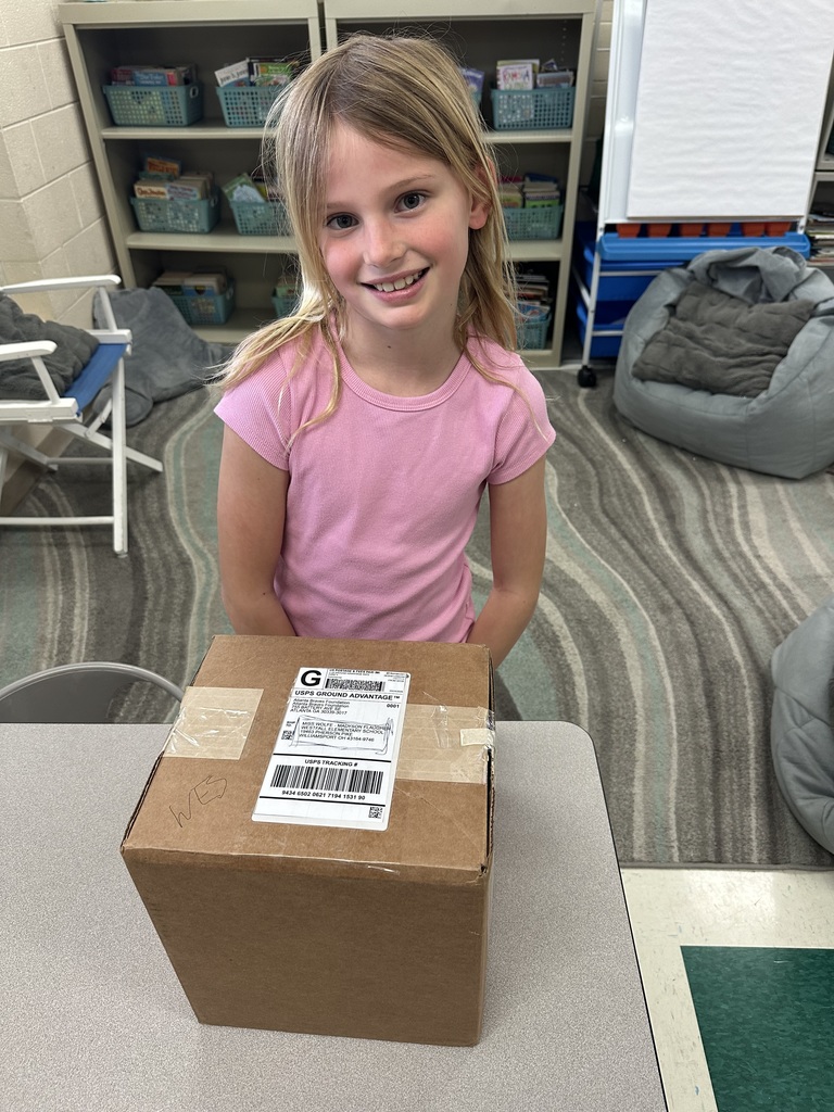 Madyson with a brown box