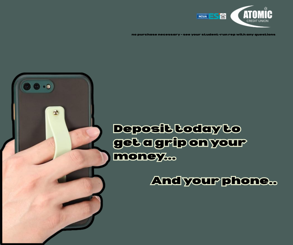Atomic Credit Union - An advertisement for Atomic Credit Union featuring a hand holding a smartphone with a light green finger-loop grip attached to the back. The text reads, "Deposit today to get a grip on your money... And your phone.."