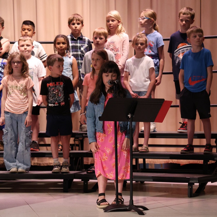 student speaking into microphone