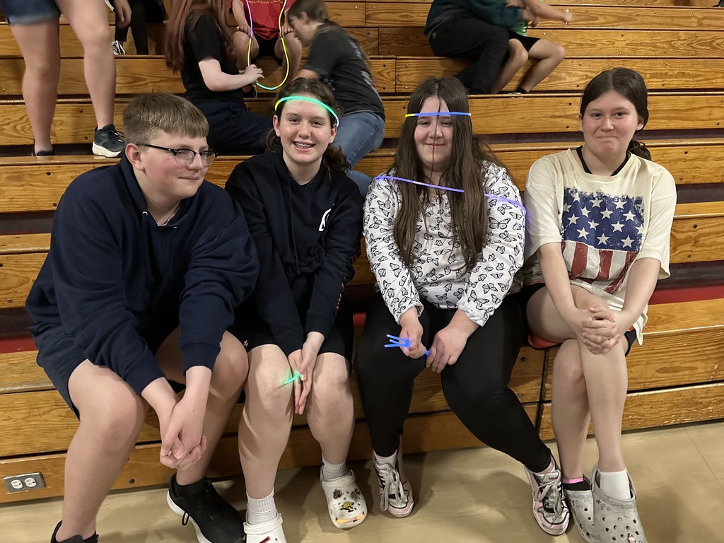 Students posing during glow party
