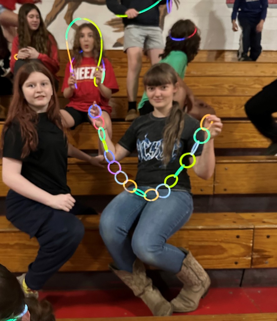 Students posing during glow party