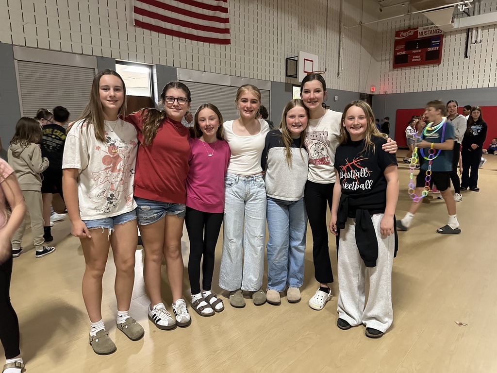 Students posing during glow party