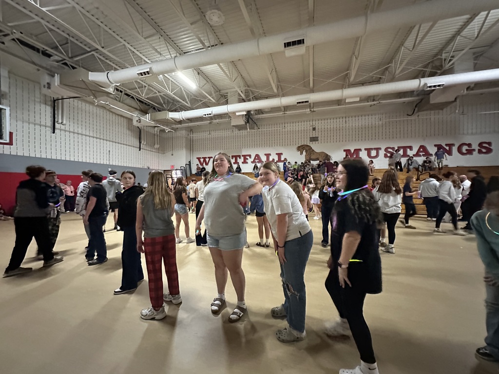 Students posing during glow party