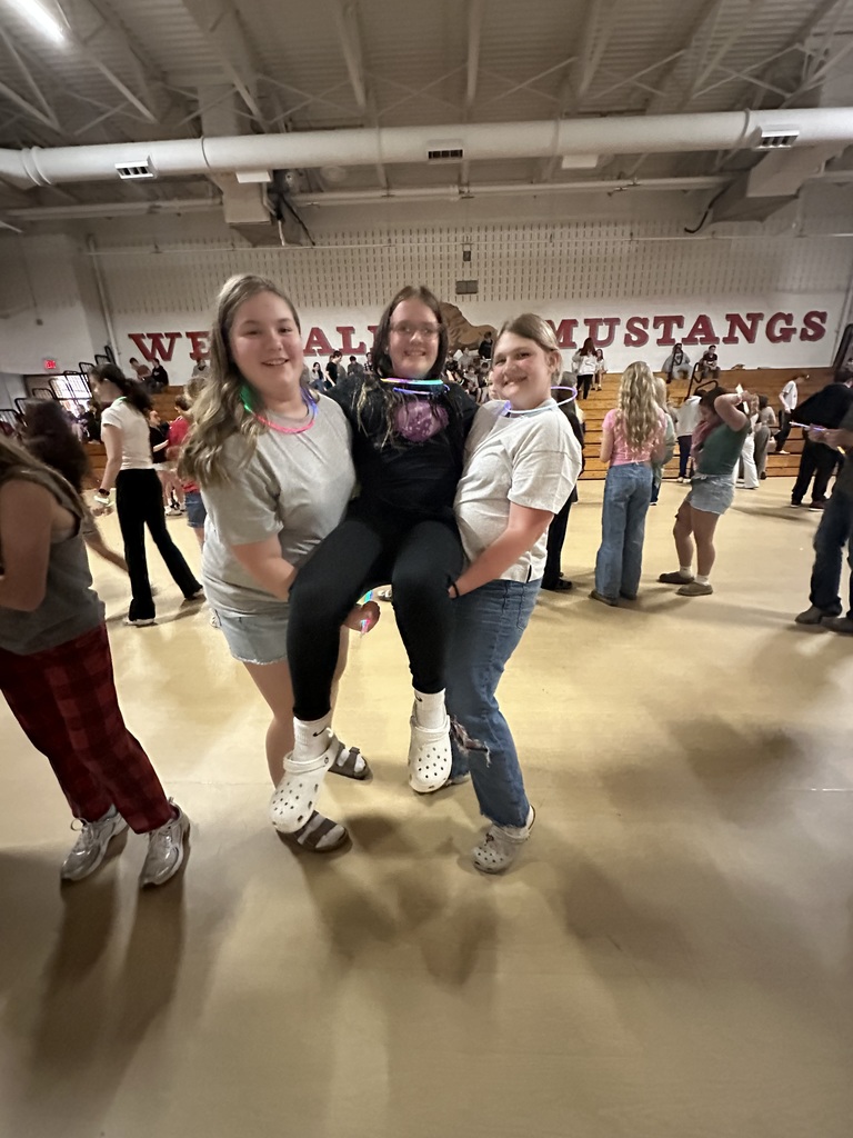 Students posing during glow party