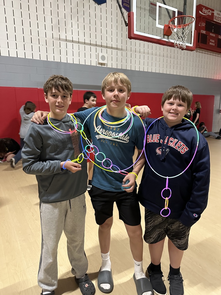 Students posing during glow party