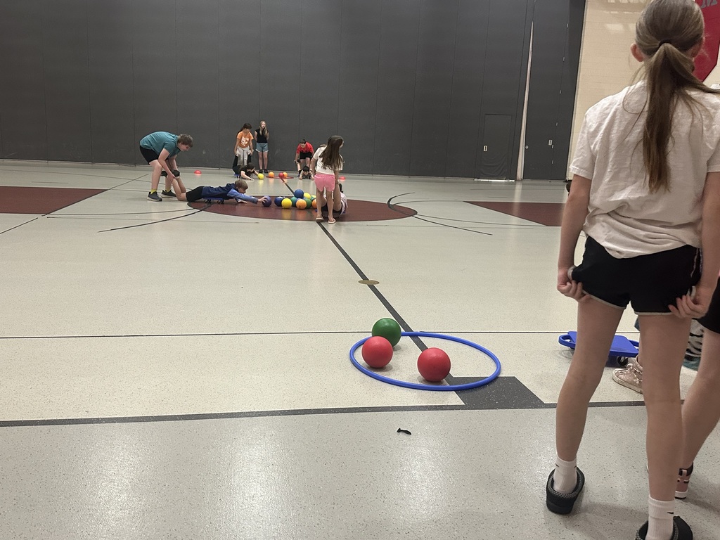 Students playing Hungry Hungry Hippos in gym class