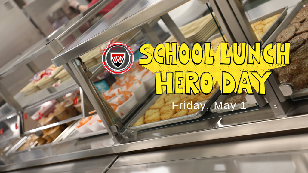 School Lunch Hero Day - A photograph of a school cafeteria serving line with trays of food, including carrots and golden-brown nuggets, visible behind glass partitions. The Westfall Local School District logo is positioned in the upper center next to the words "School Lunch Hero Day" written in a bold, yellow comic-book style font. Below the title, the text "Friday, May 1" is written in white.