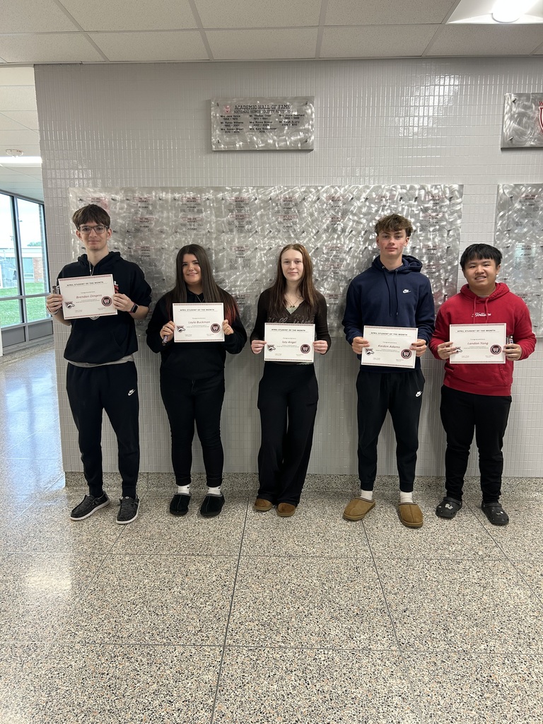 Students of the Month posing with certificates